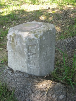 The Louisiana side of the U.S. Geodetic Survey Marker DM1223 identifying the meeting of Arkansas, Louisiana and Texas