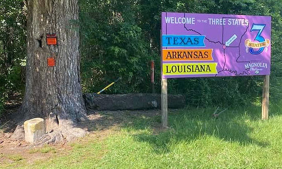 The Three States marker and sign: Louisiana, Arkansas and Texas