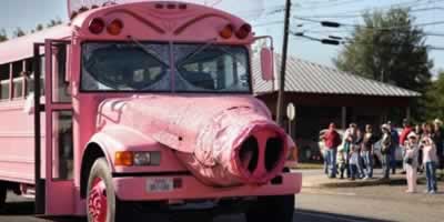 The famous pink hog bus on parade in Ben Wheeler, Texas