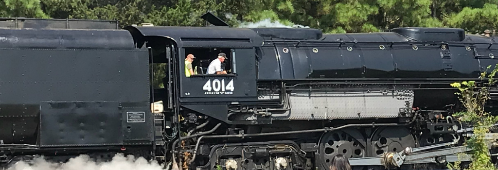 Ed Dickens, chief of 4014's restoration project, and engineer on this excursion, at the controls as it moved into Jefferson